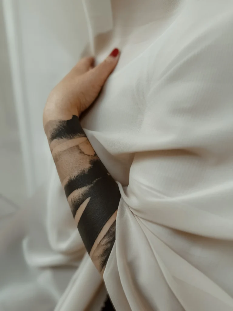 Abstract tattoo, on an arm, made by Agnes Hayden, tattoo artist, situated in her own tattoo studio in Linz.