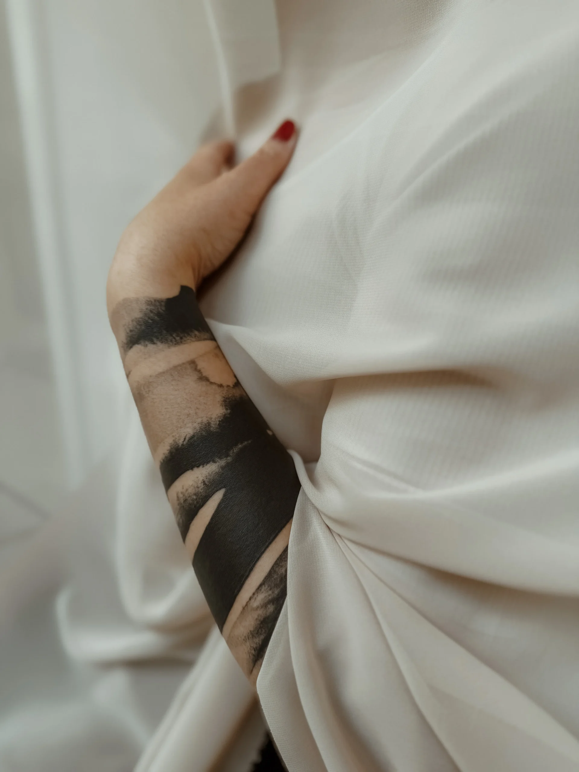 Abstract tattoo, on an arm, made by Agnes Hayden, tattoo artist, situated in her own tattoo studio in Linz.